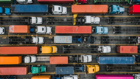 aerial view of trucks in traffic lanes